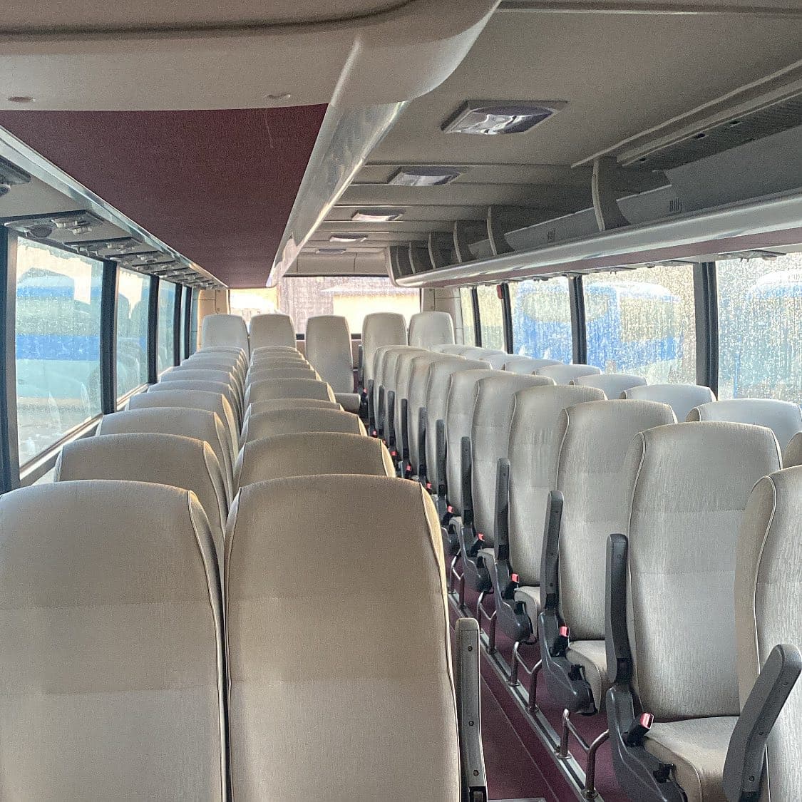 Rows of comfortable seats inside a Volcano Express intercity coach