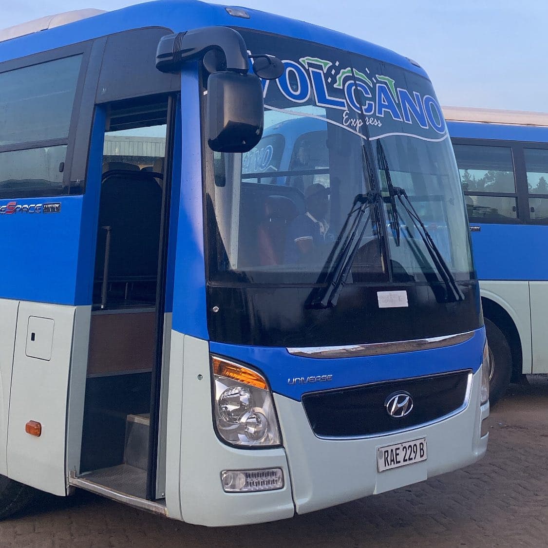 A blue and white Volcano Express Hyundai Universe Space coach